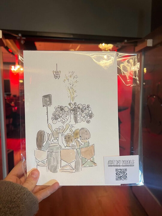 Nicole’s painting of the scene, held up at the event