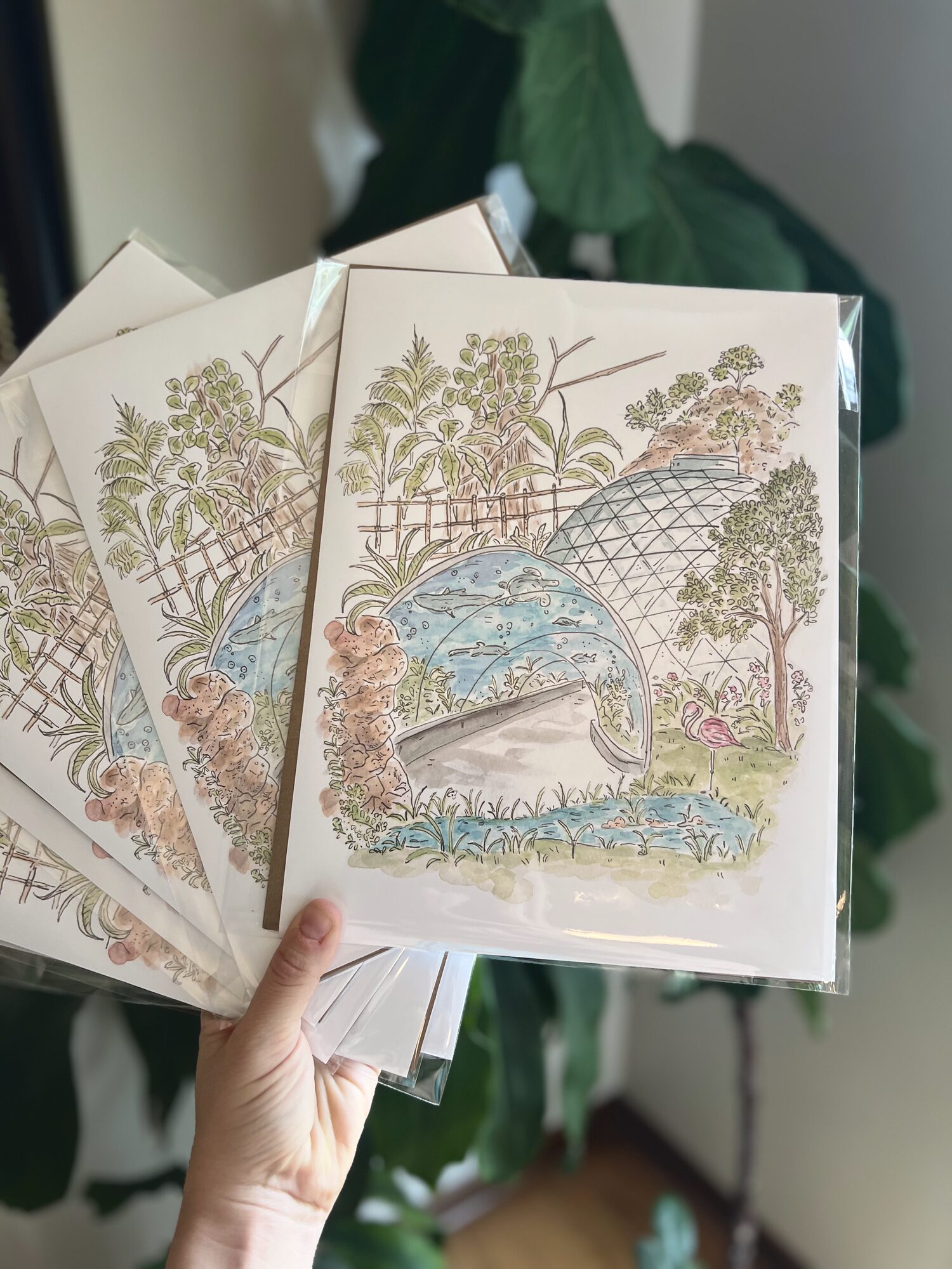 A handful of Nicole’s garden watercolor prints in protective sleeves