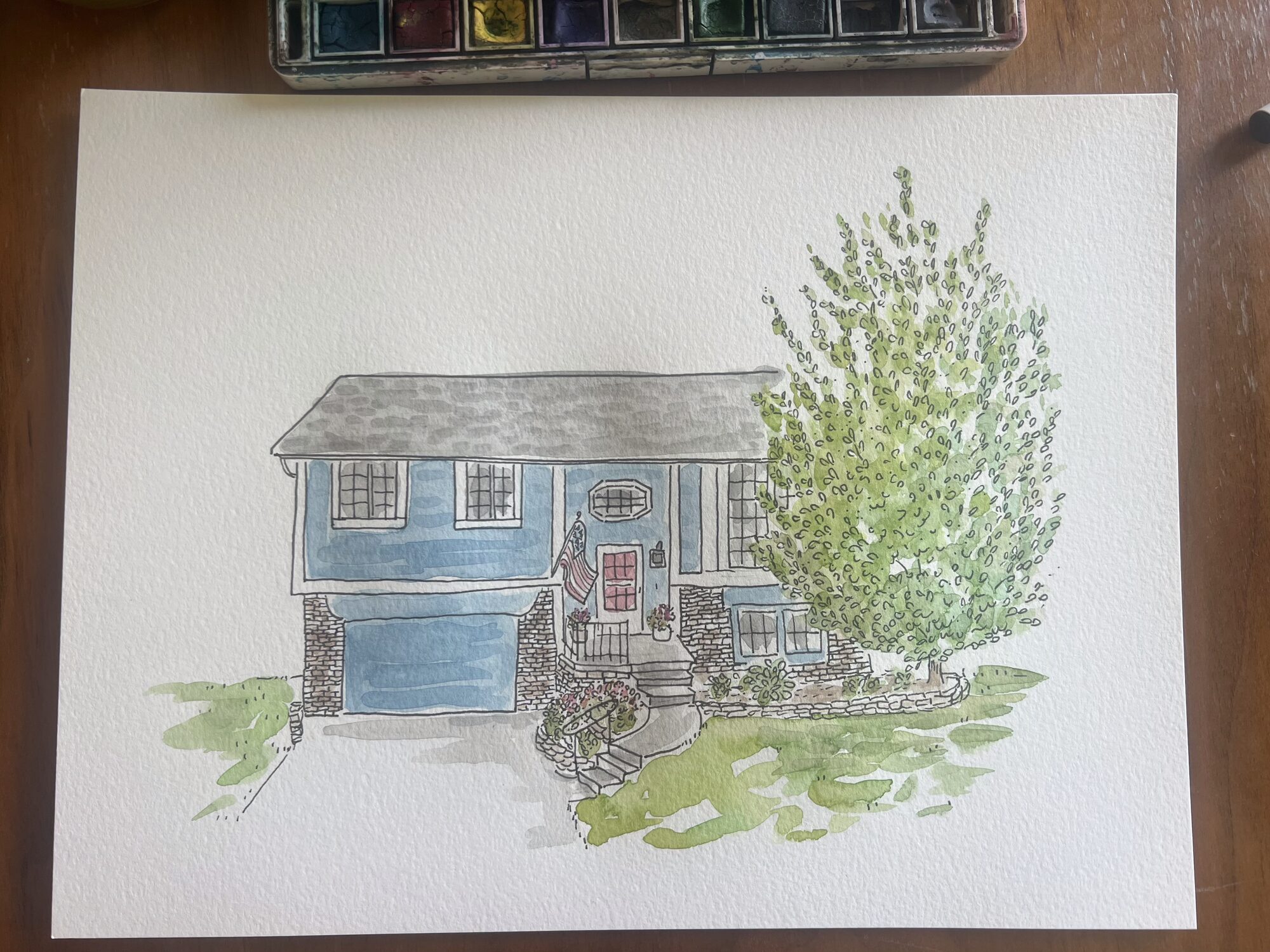Commissioned ink and watercolor portrait of a blue house with a leafy tree