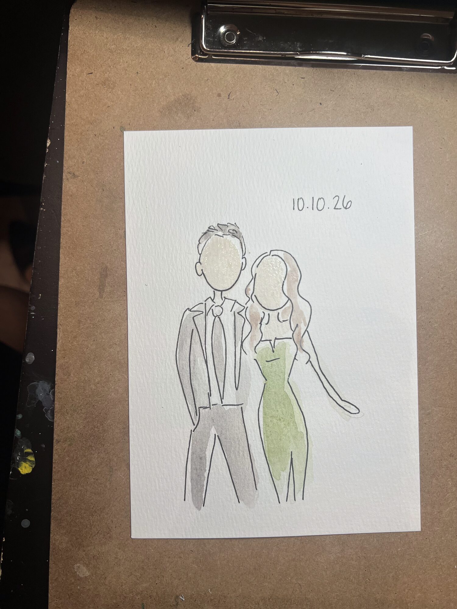 Mini portrait of a couple, she in a sage green gown, clipped to Nicole’s board